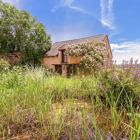 A Romantic Hamlet With Lush Gardens On A Hill